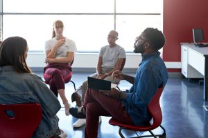 Mental health instructor advising female students